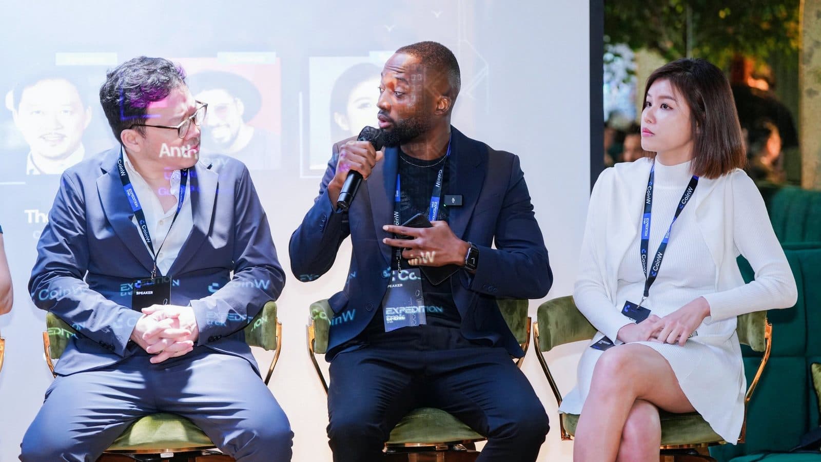 Grey Jabesi speaking on a panel at a crypto event, used for an article about Bitcoin, gold, and verifiable money.